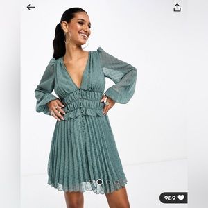 Ruched waist, pleated mini skirt in teal with a metallic textured print